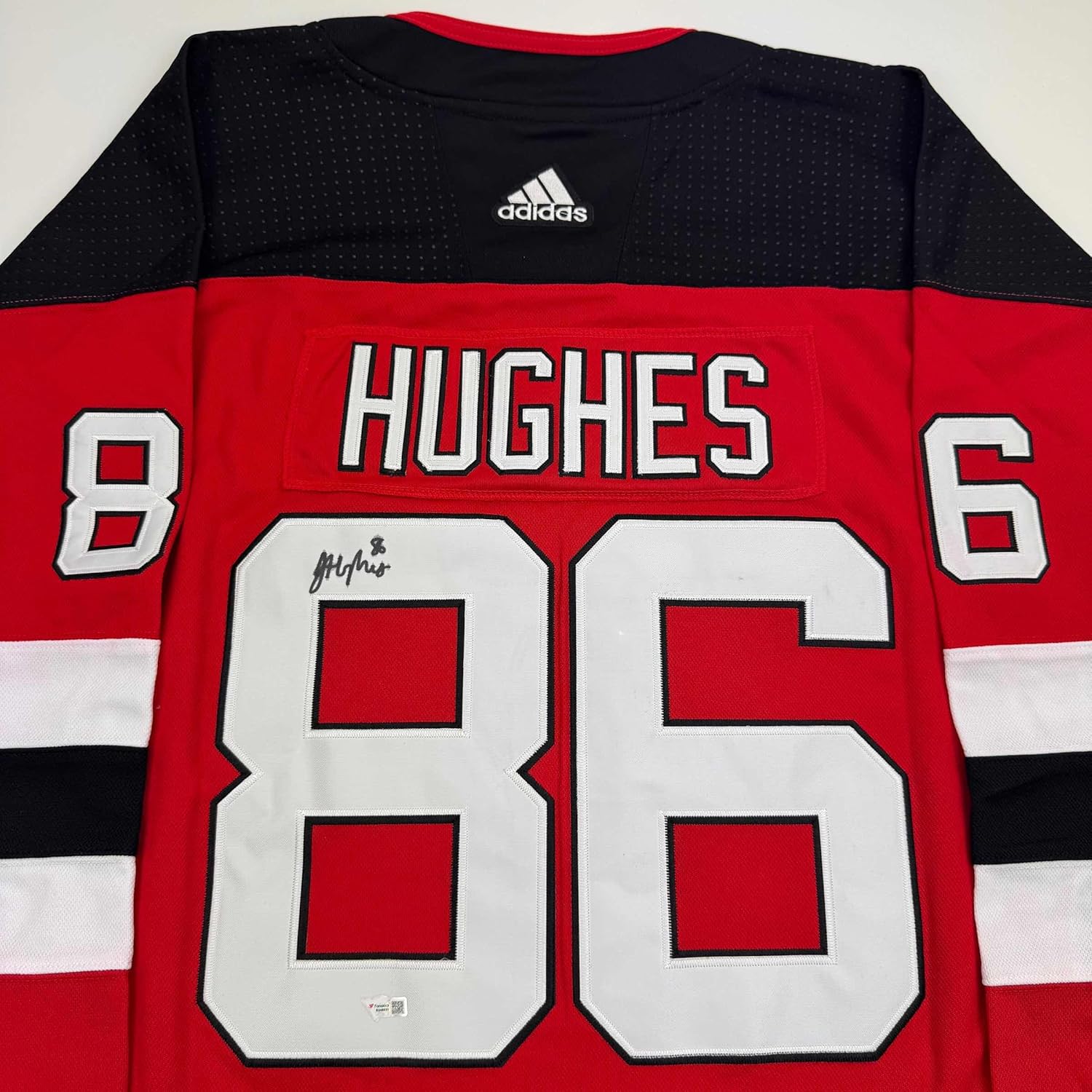 Framed Autographed Jack Hughes 35x39 New Jersey Devils Authentic Red Hockey Jersey - Image 2